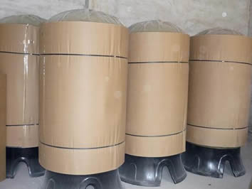 Four tripod base FRP tanks are packed by carton standing on the floor.